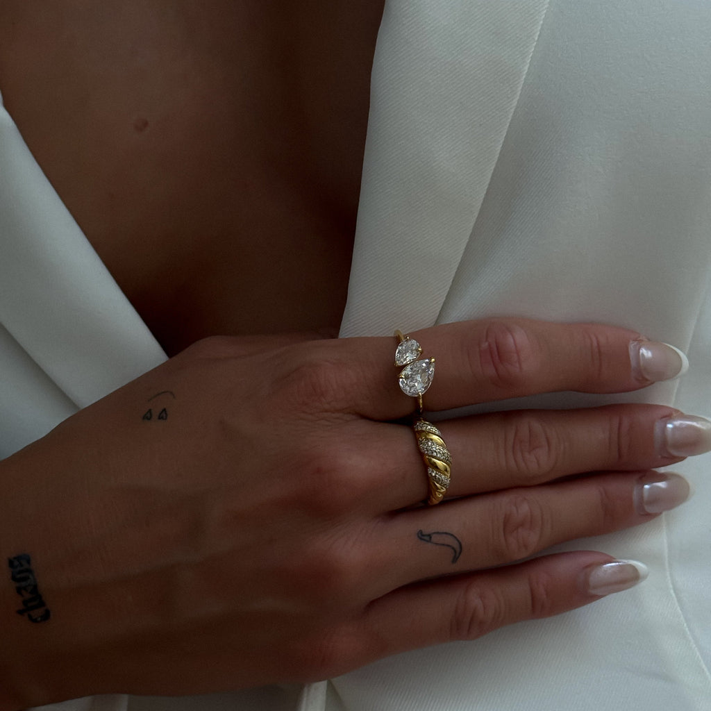 Kira Stone Ring – 18k gold plated twisted rope band with pavé-set stones, modern statement ring.