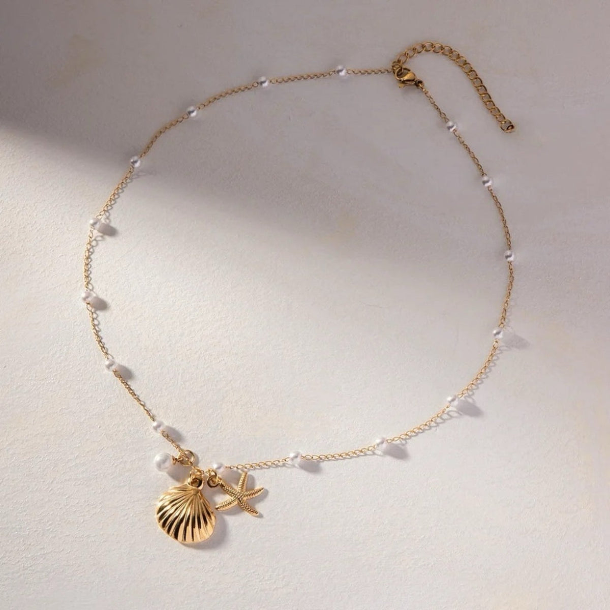 zaya collective 18k gold shell pearl necklace