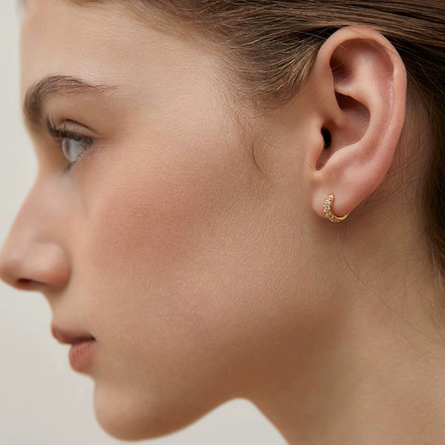 Mika Mini Huggie Earrings – 925 sterling silver with 18k gold plating and pavé detailing, small hoop earrings for everyday wear.