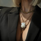 Kalia Shell Necklace – 18k gold-plated chain with hand-carved shell pendant and freshwater pearl accents, coastal luxe jewellery piece