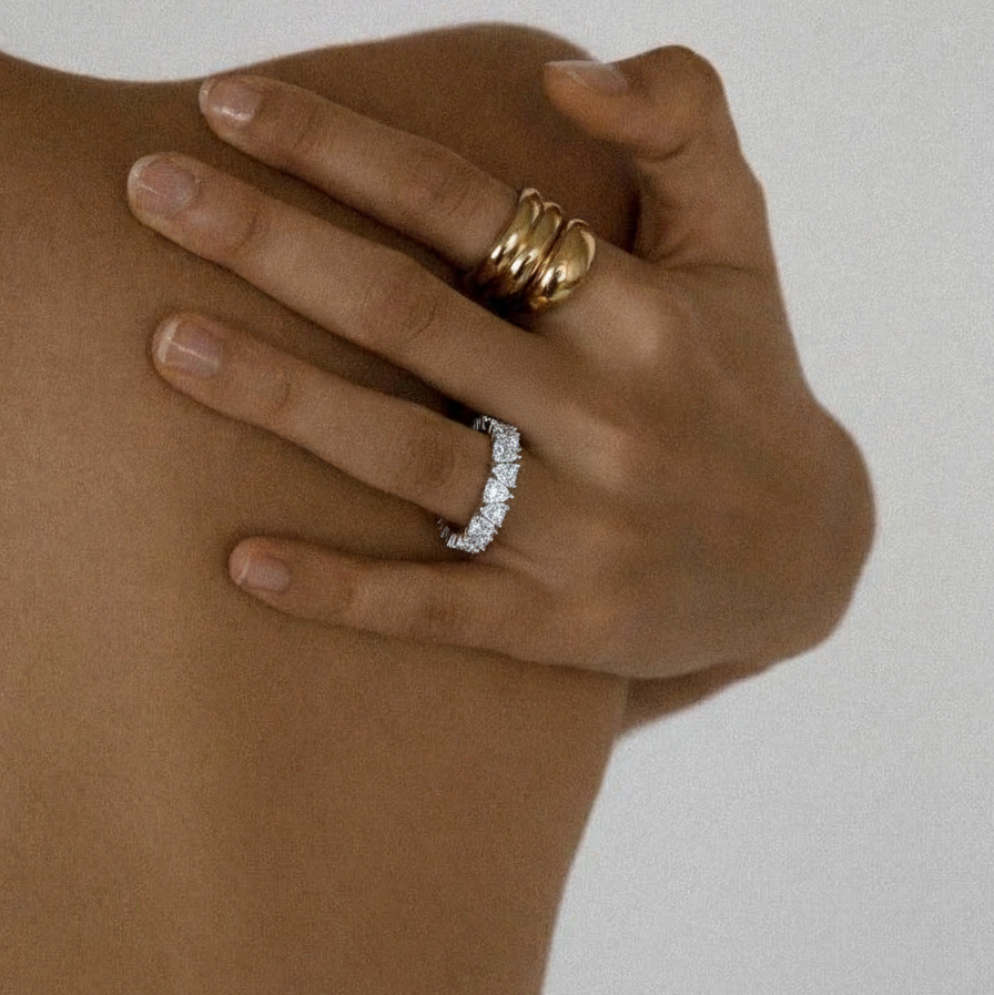 Romantic eternity ring in polished sterling silver with subtle hearts - Zaya Collective